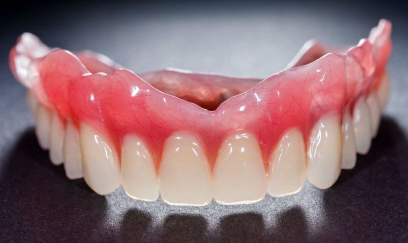 Dentures vs Implants: Pros and Cons